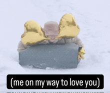 a picture of a person in the snow with the words " me on my way to love you " below them