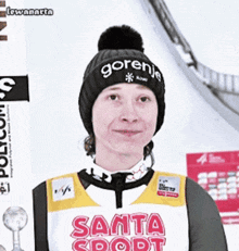 a woman wearing a gorenje beanie and a santa sport shirt
