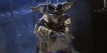 a gremlin wearing sunglasses and a trench coat is holding a fish