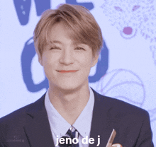 a young man in a suit and tie is smiling with the words jend de j above his head