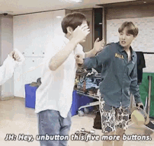 two young men are standing in a room and one of them says hey unbutton this five more buttons ..
