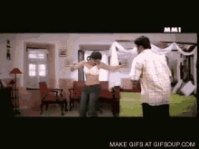 a man and a woman are dancing in a room with the words make gifs at gifsoup.com