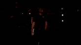 a football player wearing number 2 walks into a tunnel