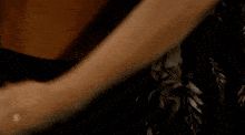 a man and a woman are kissing with the cbs logo in the corner