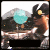 a blurry picture of a man wearing sunglasses and a black frame