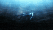a skeleton is floating in the water with a sword
