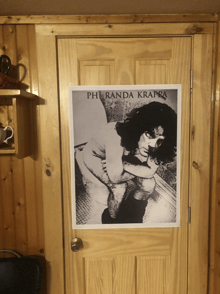 a poster on a wooden door shows a naked man with the name pheranda krappa on it