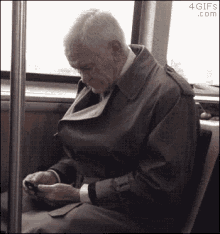old man smart phone scrolling grumpy