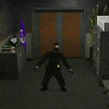 a man in a black uniform is standing in a hallway with his hands in the air