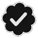 a black and white check mark in a cloud shaped sticker .