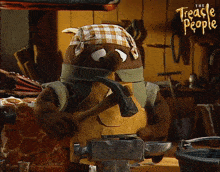 a cartoon character from the treacle people is working on a piece of metal