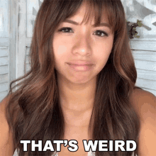 a woman says that 's weird while making a face