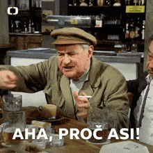 a man sitting at a table with a cigarette in his mouth and the words aha procasi