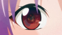 a close up of a girl 's eye with a reflection of a person in it