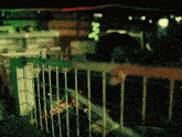 a person is behind a fence with a green sign that says ' n ' on it