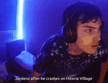 a man wearing headphones is talking about jaydenz after he crashed on hiteria village
