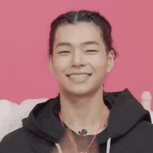 a woman covering her face with a red lip drawing