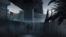 a person walking up stairs in the rain