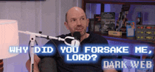 a man is sitting in front of a microphone with the words " why did you forsake me lord " behind him