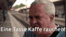 a man 's face is shown with the words eine tasse kaffe rauchen