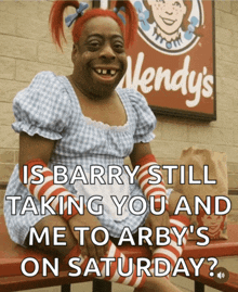 a wendy 's sign is behind a woman in a costume