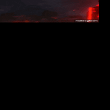 a person in a red suit is standing in a dark room with a make a gif.com watermark in the corner