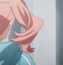 a girl with pink hair is wearing a blue jacket with white stripes