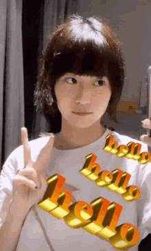 a girl is wearing a white shirt that says hello