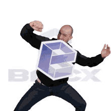 a man is holding a cube with the letter e on it in front of the letter b