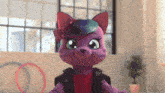 a purple stuffed animal with a flower in its hair