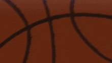a basketball is being thrown in the air by a player