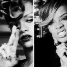a black and white photo of a woman smoking a cigarette and giving the middle finger .