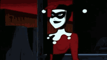harley quinn from the batman animated series is wearing a red and white outfit and a mask .
