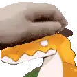 a cartoon snake wearing a hat with a hole in it 's mouth .