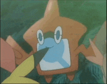 a cartoon character with a blue face and a yellow tail is swimming in the ocean .