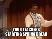 a man in a suit and tie is dancing in front of a wooden door and says `` your teachers starting spring break '' .