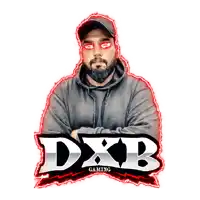 a man with a beard stands in front of a logo for dxb gaming
