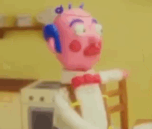 a cartoon character is standing in a kitchen wearing a bow tie .