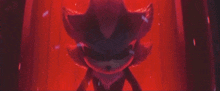 shadow the hedgehog from sonic the hedgehog is standing in a red room .