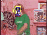 a woman in a green shirt is standing in front of a dart board with a box that says domino on it