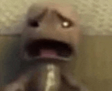 a close up of a cartoon character with a shocked look on his face and mouth .