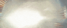 a blurred image of a light coming out of a pipe
