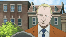 a man in a suit and tie is standing in front of a brick building