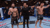 two men in a boxing ring with a bud light sign in the background