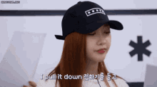 a woman wearing a black hat says i pull it down in korean