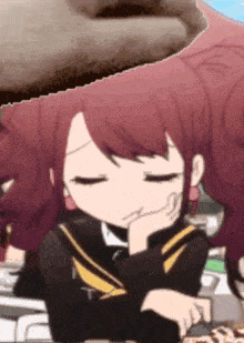 a girl with red hair is sitting with her eyes closed and her hand on her chin