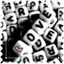 a pile of white beads with black letters that spell out the word love .