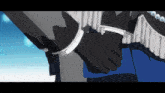 a person wearing black gloves holds another person 's arm