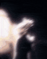 a blurry image of a person with flour written on the bottom right