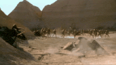a group of soldiers are standing in a desert landscape